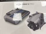 Dron DJI Mini 5 Pro con RC2 y pack Fly More Combo Plus - photo 1